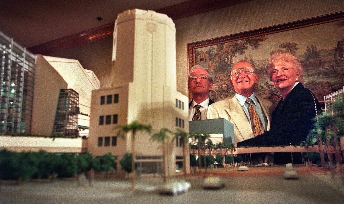 In this file photo from Sept. 22, 1999, Sanford and Dolores Ziff pose with a model of a soon-to-be-built arts center during a press conference announcing their donation of $10 million for the Performing Arts Center for Greater Miami. At left is Ron Esserman, who helped broker the donation. The new center opened in 2006 and today is known as the Adrienne Arsht Center for the Performing Arts on Biscayne Boulevard in downtown Miami.