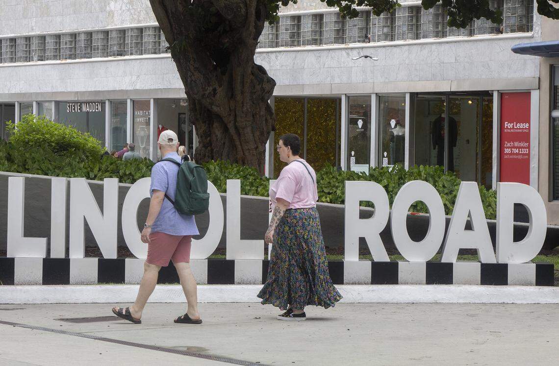 People walk in front of a Lincoln Road sign on Lincoln Road in Miami Beach in this file photo from Sept. 18, 2025. The mall is undergoing a spruce-up. Uniqlo is a coming retailer, aimed at a fall 2026 debut on the shopping strip.