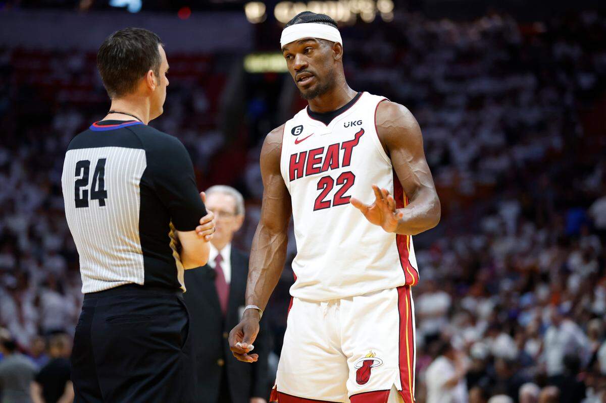 Miami Heat forward Jimmy Butler (22) speaks with game official Kevin Scott in the first quarter during the game against the New York Knicks in Game 6 of the NBA Eastern Conference Semifinals at the Kaseya Center in Miami on Friday, May 12, 2023.
