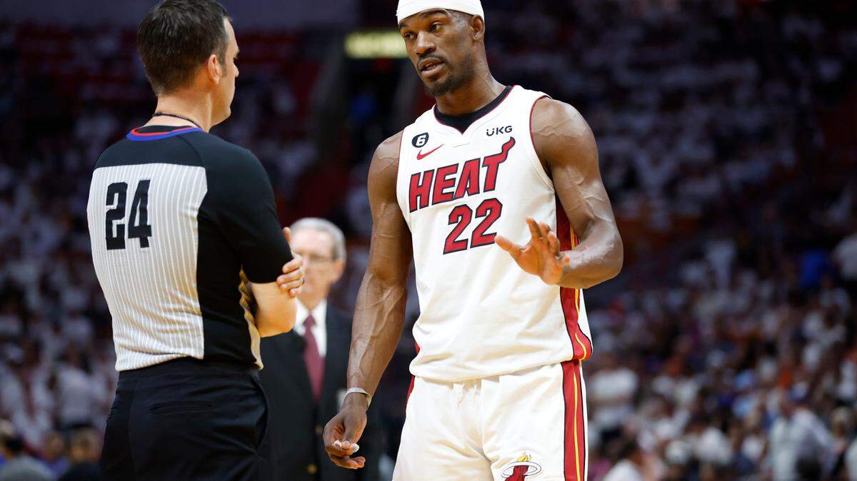 Miami Heat forward Jimmy Butler (22) speaks with game official Kevin Scott in the first quarter during the game against the New York Knicks in Game 6 of the NBA Eastern Conference Semifinals at the Kaseya Center in Miami on Friday, May 12, 2023.