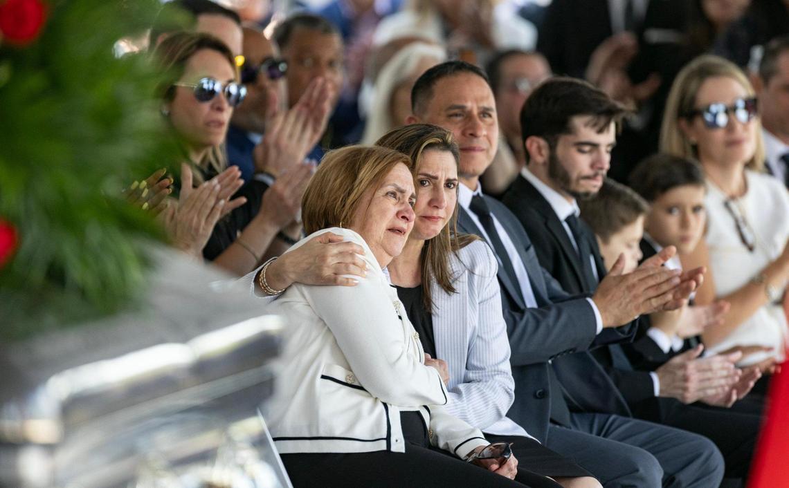 Chacha Reyes, the wife of Miami City Commissioner Manolo Reyes, who died on Thursday, reacts during a memorial service at Miami City Hall on Wednesday, April 16, 2025. Seated next to her is daughter Meily Reyes.