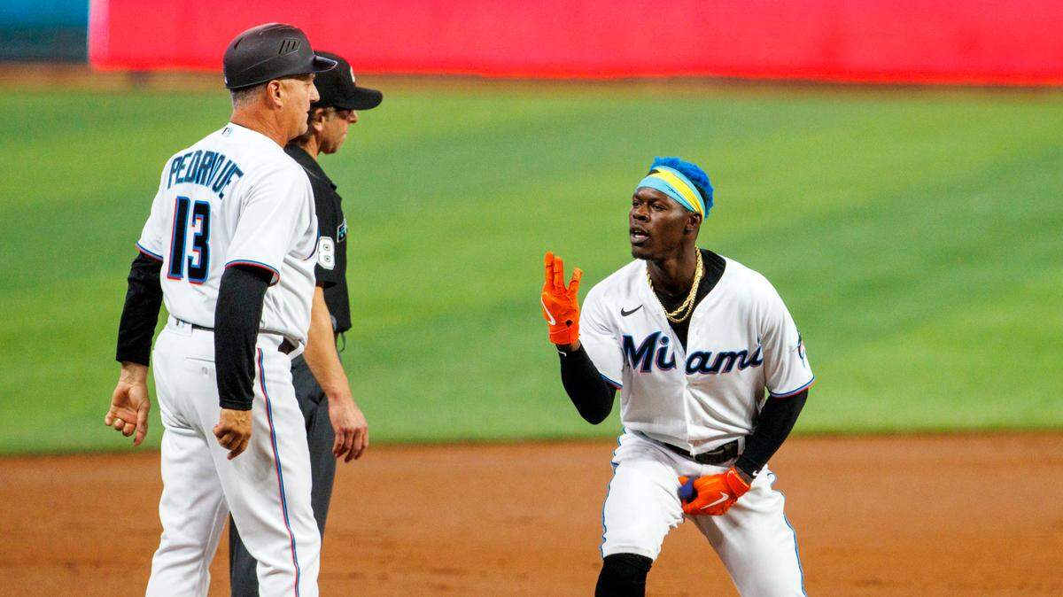 Miami Marlins second baseman Jazz Chisholm Jr. (2) reacts after hitting a triple during the first inning of a baseball game against the Washington Nationals at LoanDepot Park on Wednesday, May 18, 2022 in Miami, Florida..