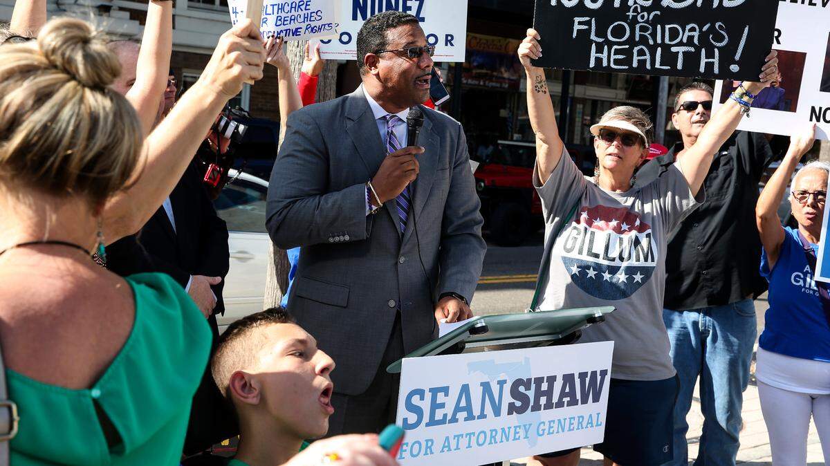 Florida attorney general candidate Sean Shaw speaks outside of the Italian Club before a Ron DeSantis campaign stop on Thursday, Oct. 4, 2018, in Tampa.