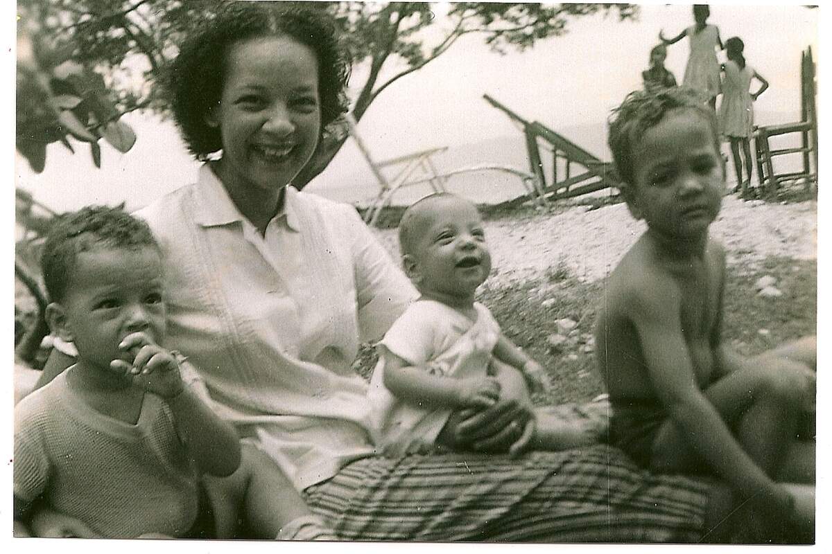 Lyliane Gaetjens with his son Lesly, Richard with hand in mouth and Jerry the baby.