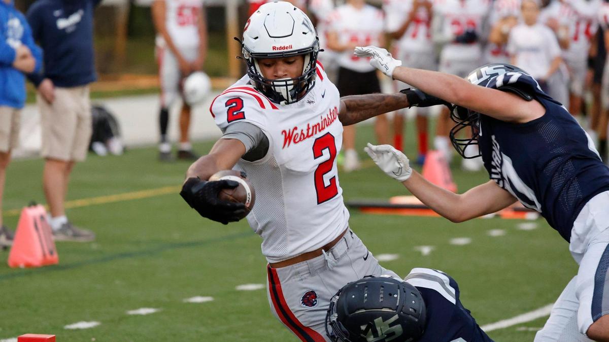 Westminsters’s wide receiver DJ Wimbley (2) reaches for the goal line to score against University School at AutoNation Field at the University School campus in Davie, Fl. on Thursday, November 2, 2023.
