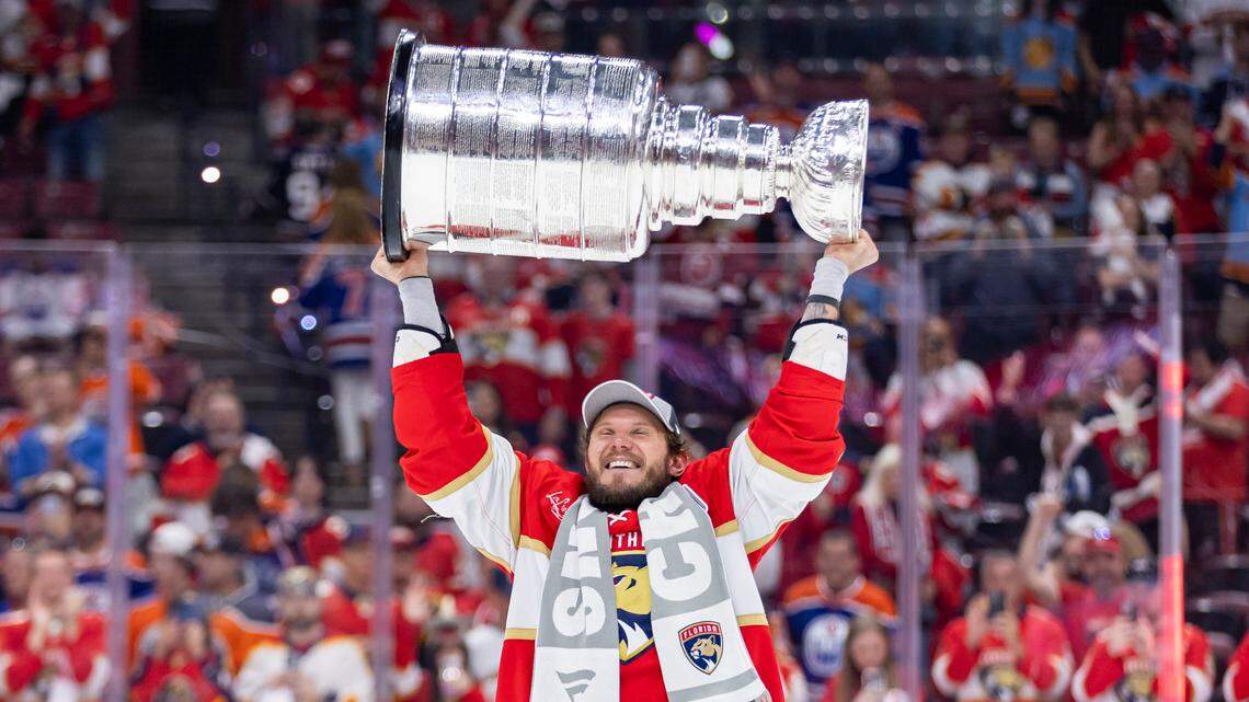 Florida Panthers defenseman Dmitry Kulikov (7) lifts the Stanley Cup after defeating the Edmonton Oilers in Game 7 of the Stanley Cup Final at Amerant Bank Arena on Monday, June 24, 2024, in Sunrise, Fla.