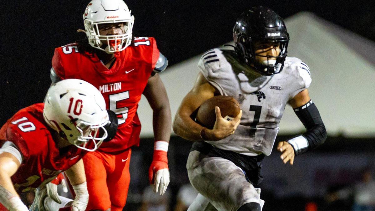 Western quarterback Davi Belfort (1) keeps the ball during the 2023 Broward County National Football Showcase against Milton High at Western High School in Davie, Florida, on Thursday, August 24, 2023.