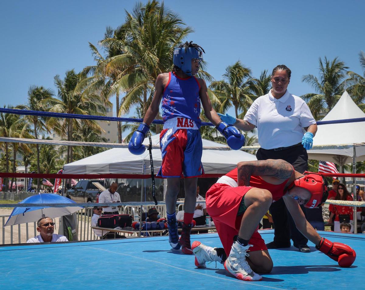Young boxer Nasi Henry, 15, looks towards the referee as Adrian Martinez, 17, goes down and tries to catch his breath as he attempts to get to his feet during the 3rd bout of the USA Boxing: Freedom Fighters boxing sessions. On Sunday, May 28, 2023 the Hyundai Air & Sea Show returned to Miami Beach on Memorial Day Weekend (May 27, 2023 and May 28, 2023.) The event showcases the men, women, technology, and equipment from all five branches of the United States military as well as local police, firefighters, and their first responder agencies. The four block long Display Village that contains a Kid Zone, flight and navigation simulators, tactical training equipment, rifle range simulators, interactive displays from all five branches of the U.S. Military and the Monster Energy Action Zone which showcases a one-of-a-kind action-packed motocross performance by Keith Sayer’s FMX (Freestyle Motocross) demonstration team.