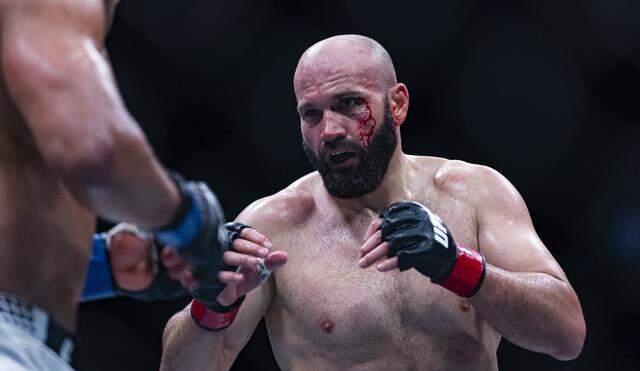 Azamat Murzakanov of Russia and Paulo Costa of Brazil fight in their light heavyweight bout at UFC 327 at the Kaseya Center on Saturday, April 11, 2026, in downtown Miami, Fla.