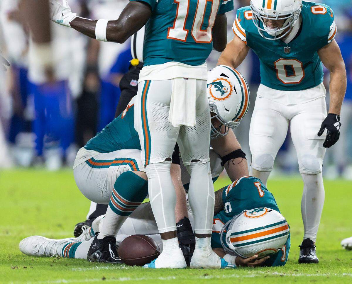 Miami Dolphins quarterback Tua Tagovailoa (1) suffers a concussion after a play against the Buffalo Bills in the second half of their NFL game at Hard Rock Stadium on Thursday, Sept. 12, 2024, in Miami Gardens, Fla.