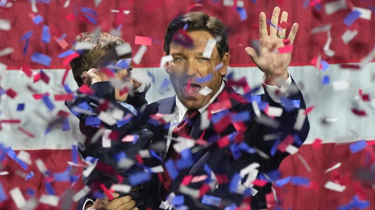 Florida Gov. Ron DeSantis holds his son Mason as he celebrates winning a second term in office on Nov. 8.