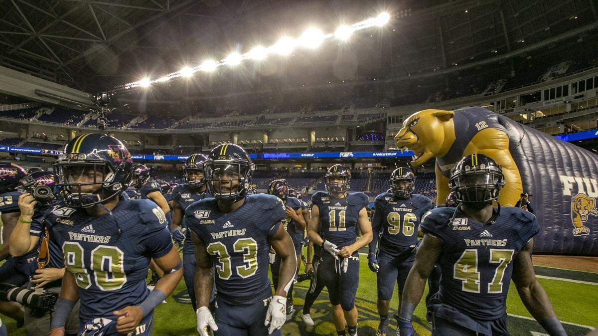 FIU Panthers on the field for warmups before the start of the game as Florida International University Panthers host the University of Miami Hurricanes at Marlins Park in Miami on Saturday, November 23, 2019.