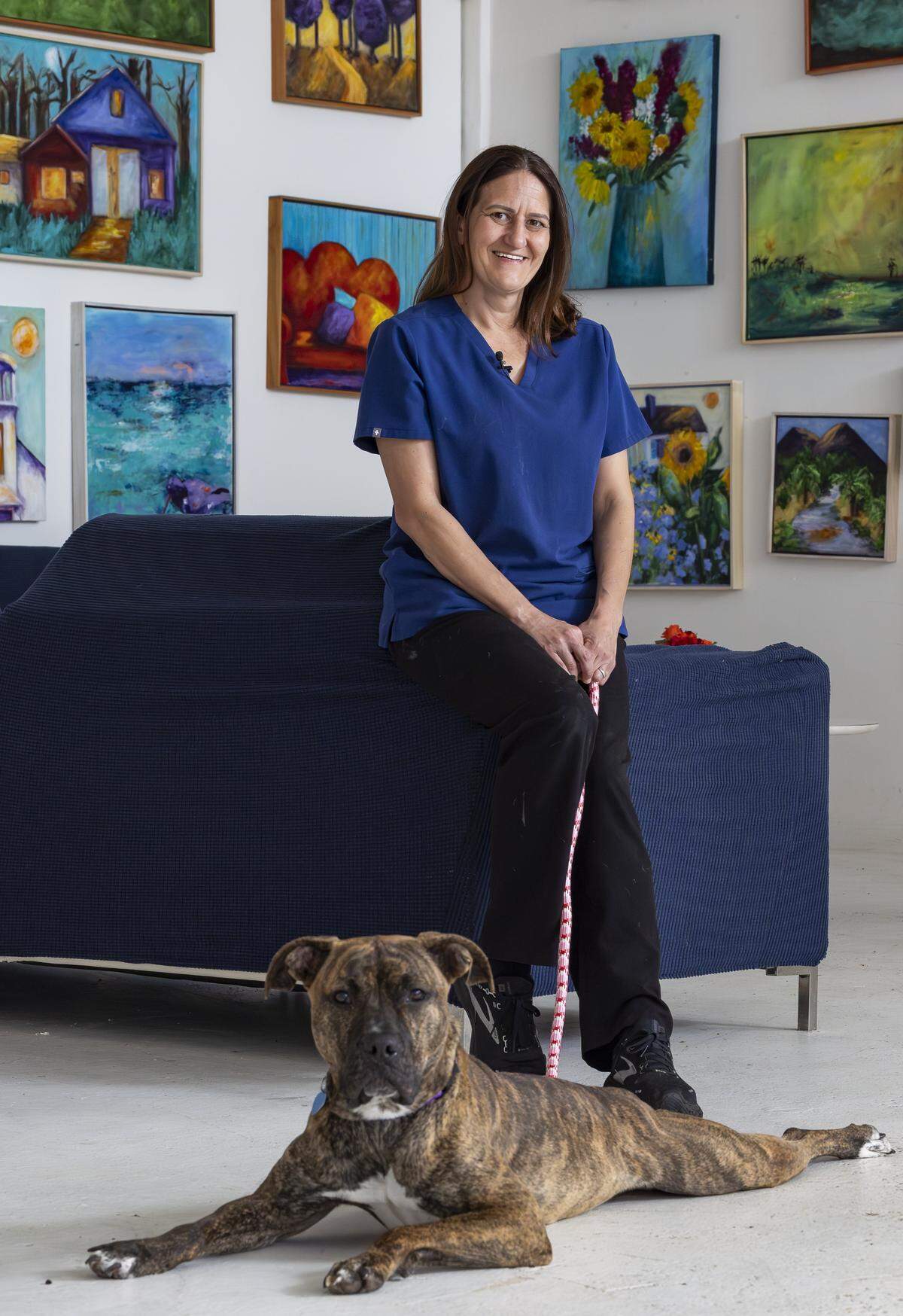 Kara Starzyk, executive director, is photographed with Jordan near the Abandoned Pet Rescue on Wednesday, April 1, 2026, in Fort Lauderdale, Fla. The shelter is one of the largest no-kill animal shelters in South Florida and is now celebrating its 30th anniversary.