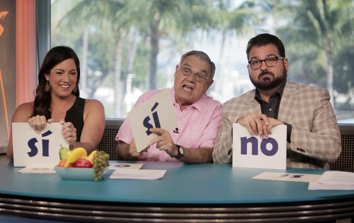 Miami Beach, Florida, December 18, 2018- Dan Le Batard (right) in the ESPN studios at The Clevelander Hotel in South Beach during taping for his TV show, Highly Questionable. Also pictured are Papi (Dan Le Batard’s father, (center) and ESPN’s own Sarah Spain (left).