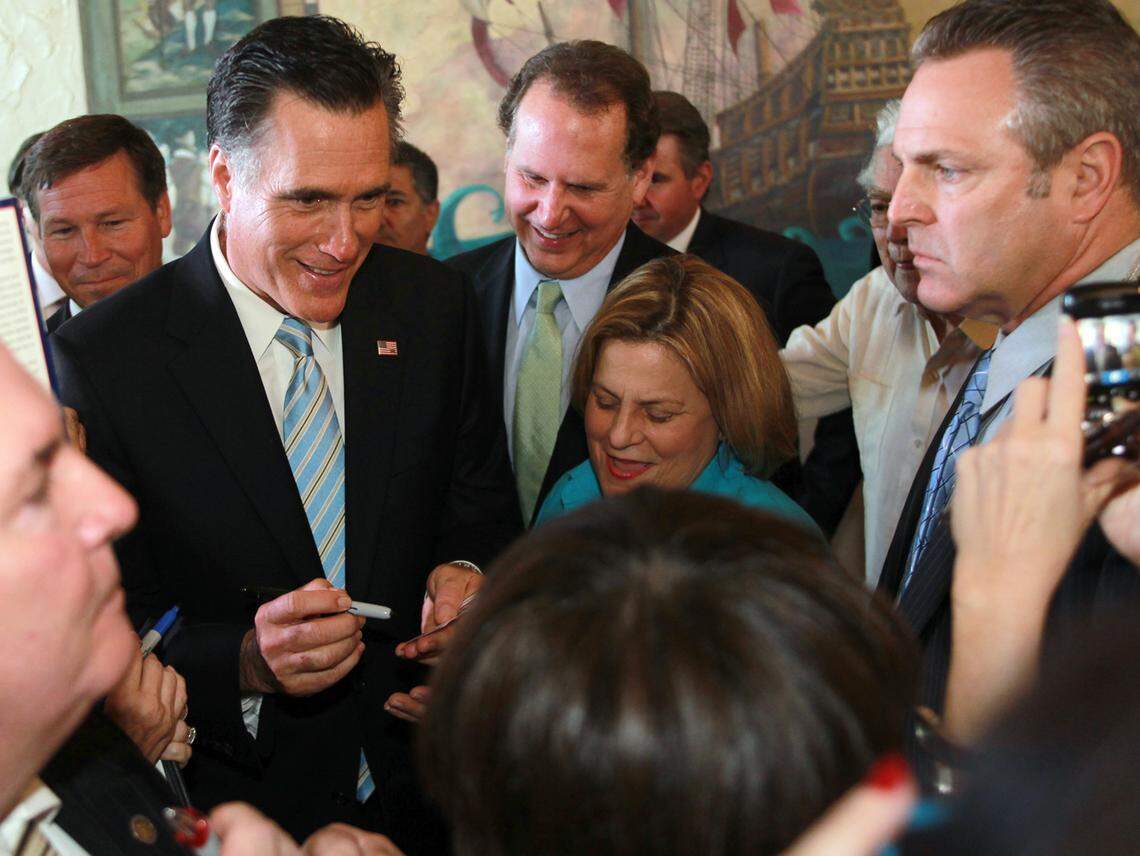 Former Congressman Lincoln Diaz-Balart (center) and then-Congresswoman Ileana Ros Lehtinen joined Republican presidential candidate Mitt Romney at the Miami Dade College Freedom Tower in Downtown Miami in 2012.