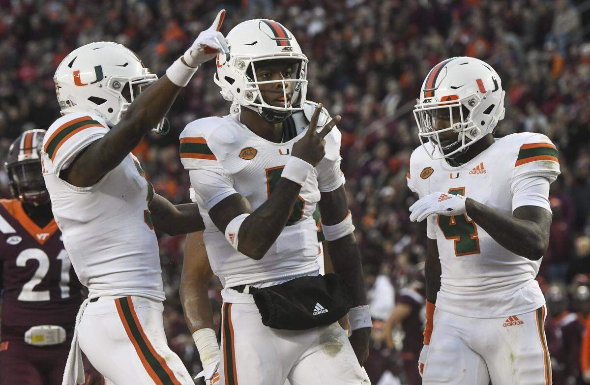 Miami Hurricanes quarterback N’Kosi Perry (5) celebrates after his touchdown run against the Virginia Tech Hokies in the first half at Lane Stadium on Nov. 17, 2018 in Blacksburg, Va.