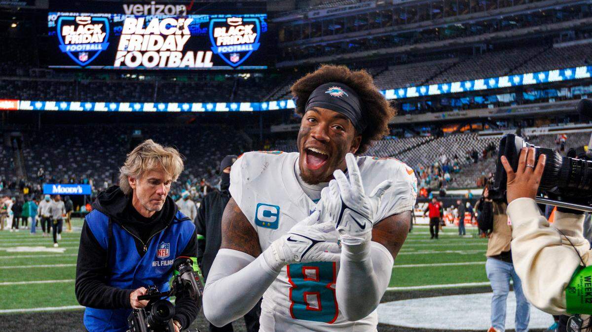 Miami Dolphins safety Jevon Holland (8) walk off the field after the Dolphins 34-13 win over the Jets during an NFL football game at MetLife Stadium on Friday, Nov. 24, 2023 in East Rutherford, New Jersey.