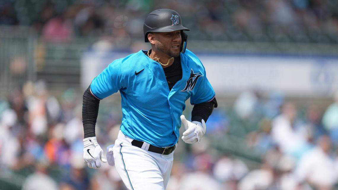 Miami Marlins designated hitter Yuli Gurriel (97) runs out a ground ball to first base in the second inning against the New York Mets at Roger Dean Stadium in Jupiter, Florida, on Monday, March 13, 2023.