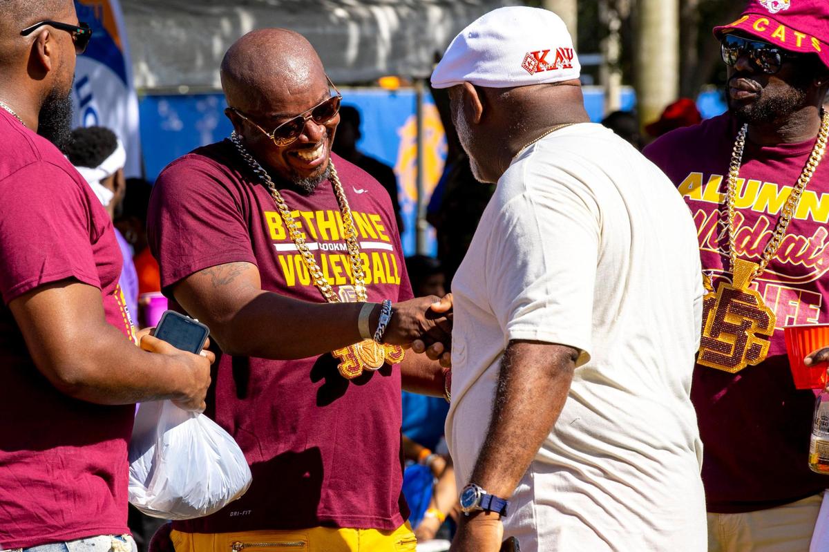 Bethune-Cookman University alumnus Roger “Duke LiveParty’ Farrell reacts with friends during the 6th Annual South Florida HBCU Picnic at Florida Memorial University in Miami Gardens, Florida, on Saturday, July 9, 2022.