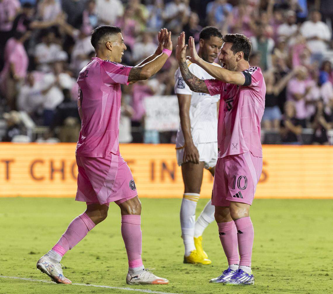 Inter Miami forward Luis Suárez (9) celebrates with Lionel Messi (10) after scoring a goal against Los Angeles Galaxy in the second half of their MLS match at Chase Stadium on Saturday, Aug. 16, 2025, in Fort Lauderdale, Fla.