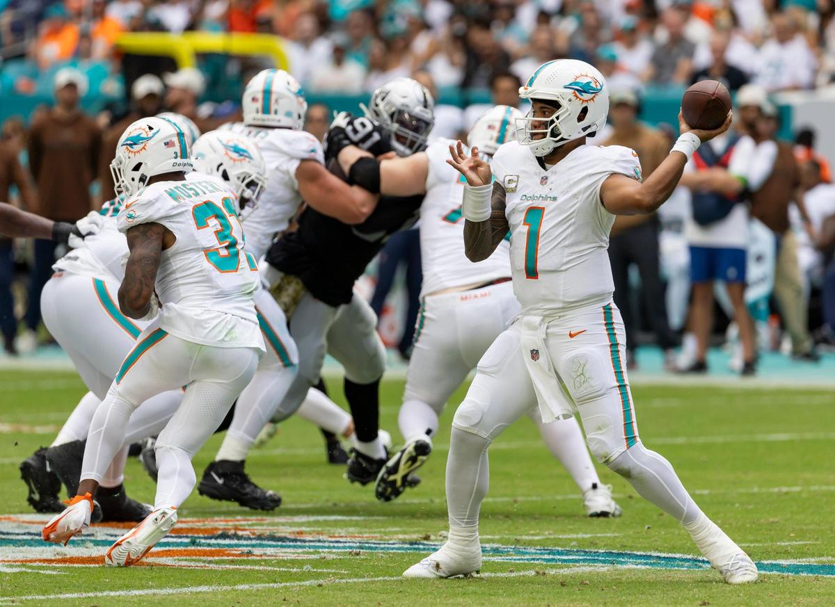 Miami Dolphins quarterback Tua Tagovailoa (1) passes the ball in the second quarter of an NFL game against the Las Vegas Raiders at Hard Rock Stadium on Sunday, Nov. 19, 2023, in Miami Gardens, Fla.