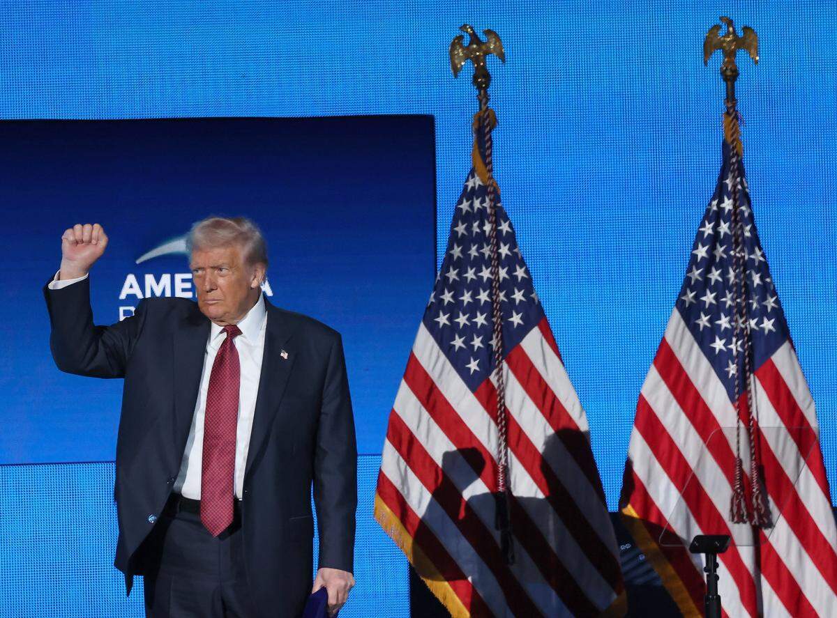 President Donald J. Trump pumps his fist while exiting the stage during the American Business Forum at the Kaseya Center in Miami, Florida on Wednesday, November 5, 2025.