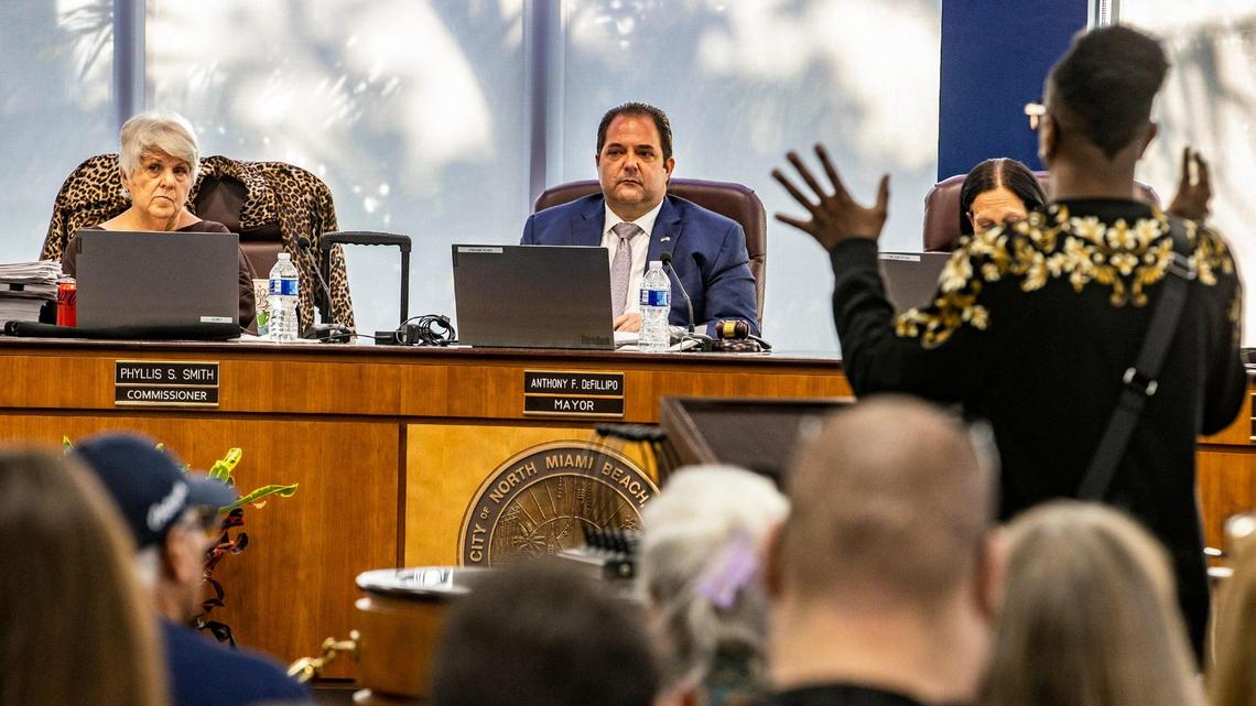 City of North Miami Beach Mayor Anthony F. DeFillipo flanked by Commissioners Phyllis Smith (far left) and Fortuna Smukler listen as a resident speaks at the City chambers as they discussed the hiring of a new city attorney during the first meeting where all commissioners attended after a judge ordered them to do so, on Tuesday March 21, 2023.