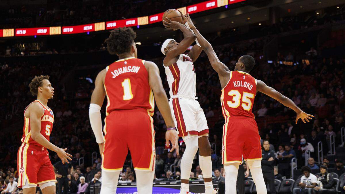 Miami Heat center Bam Adebayo (13) shoots over Atlanta Hawks center Christian Koloko (35) during the first half of a game on Feb. 3, 2026 the Kaseya Center in Miami.