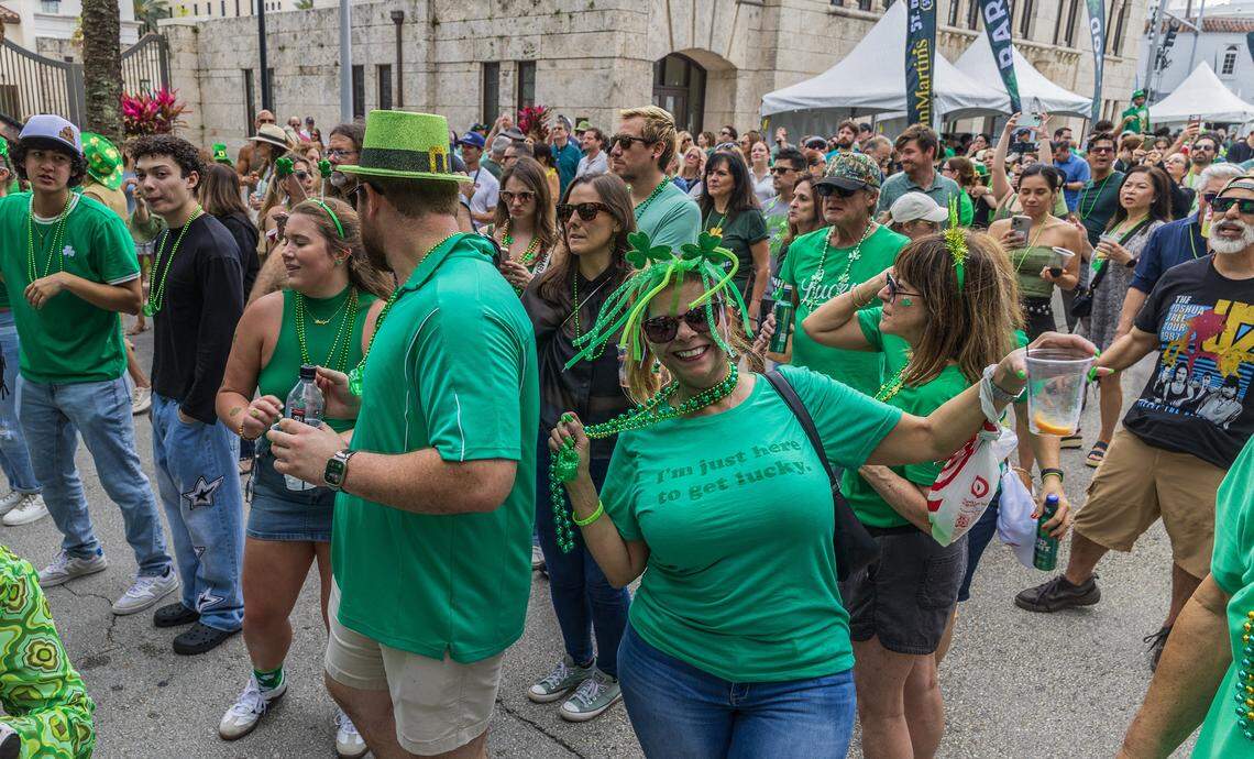 Attendees danced the music beat of the band Wide Awake, while performing a U2 tribute, during the 33rd annual John Martin's St. Patrick's Street Festival in Coral Gables, presented by John Martin's Irish Pub & Restaurant, on Saturday, March 14, 2026.