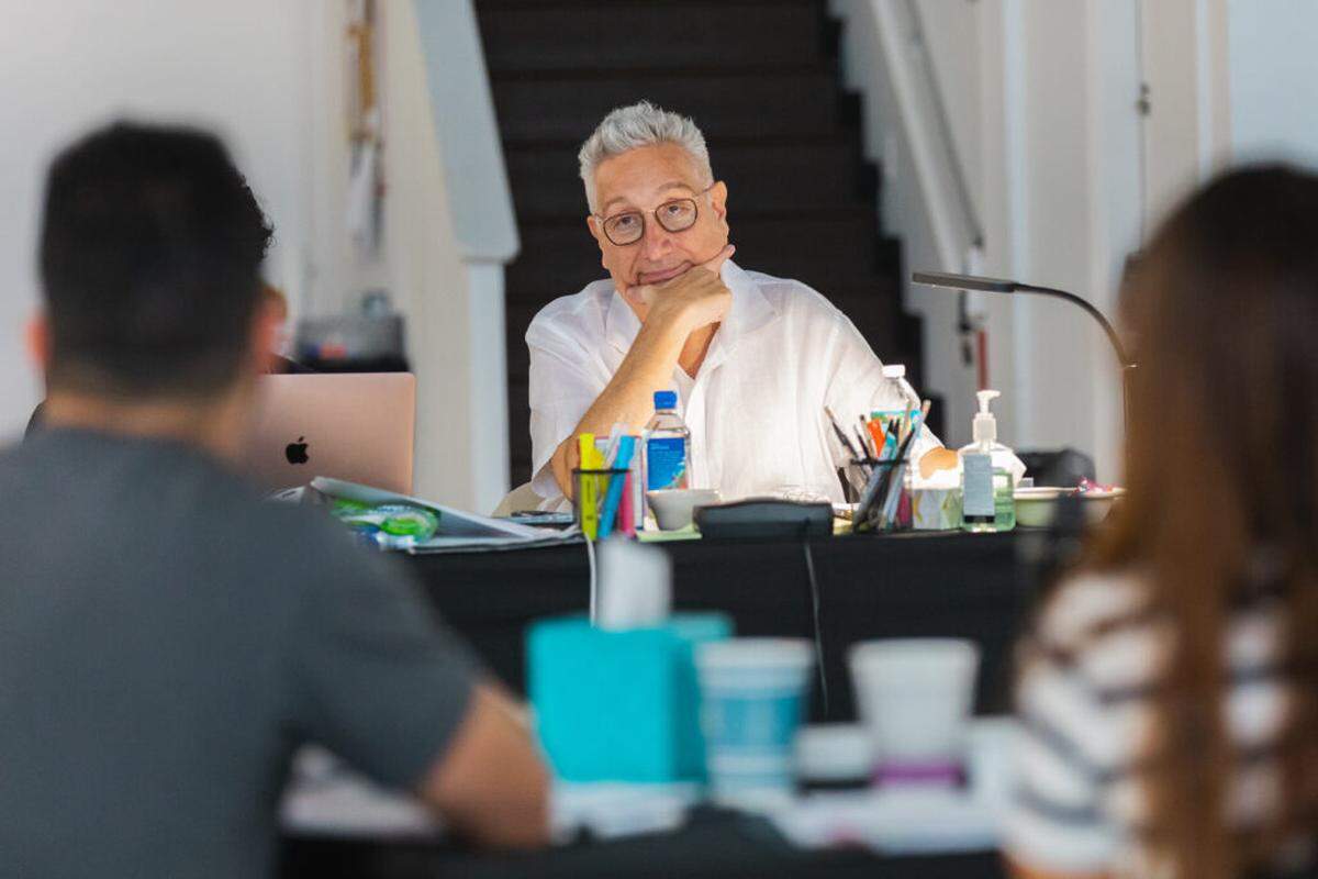 Moisés Kaufman—shown here during the 2025 table reading of “Here There Are Blueberries”—long wanted to write a play about the Holocaust but hesitated to add to what he calls “the most documented event in modern history.” The discovery of the Höcker album changed that.