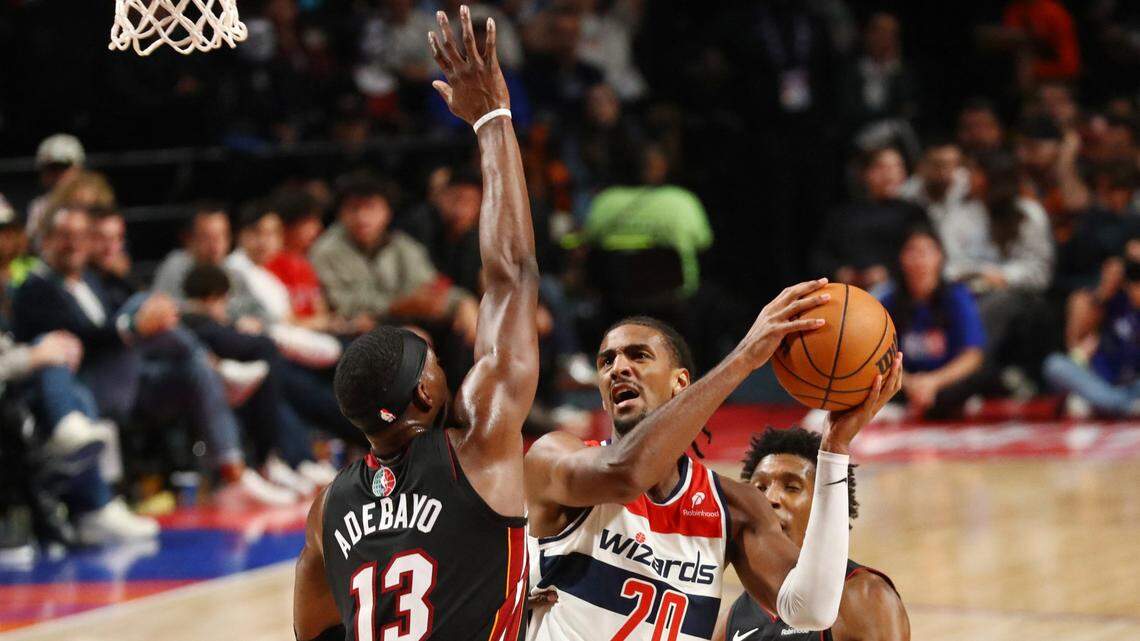 Washington Wizards player Alexandre Sarr shoots against Miami Heat player Bam Adebayo during a NBA basketball game at Arena CDMX.