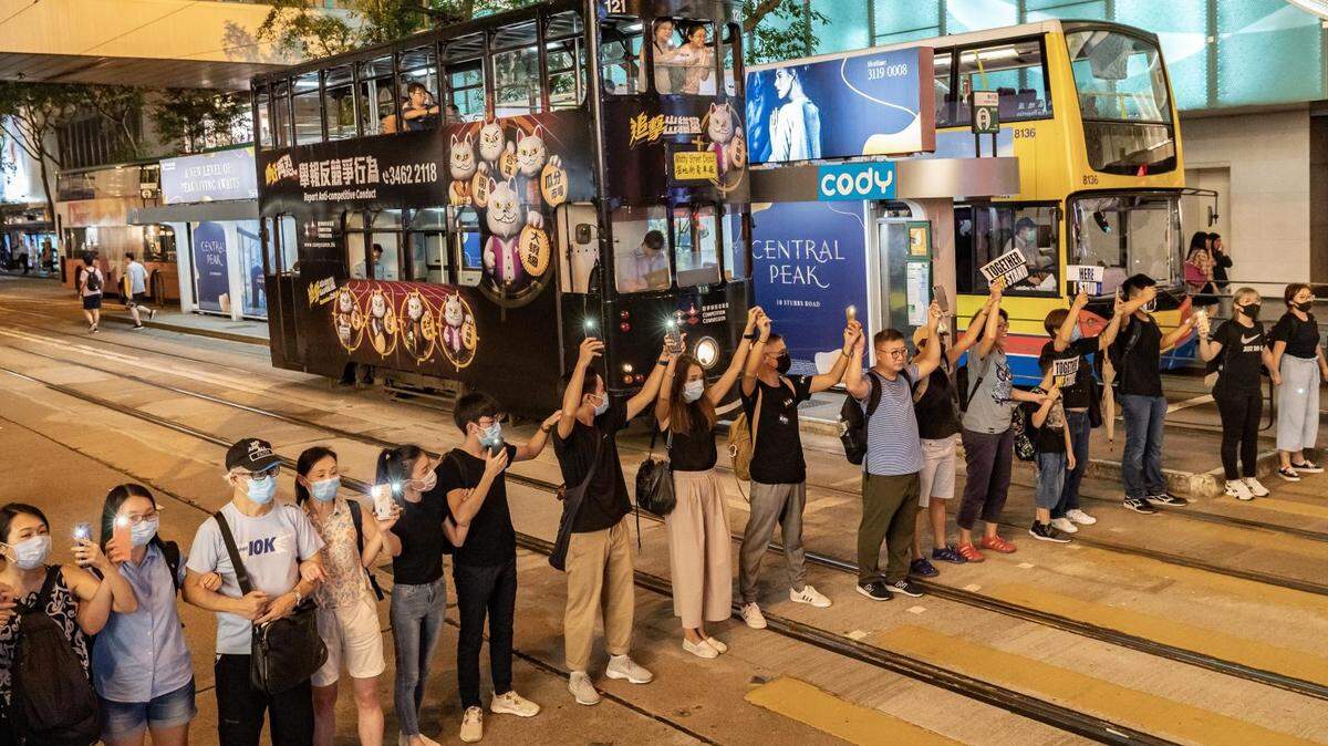 In August, hundreds of thousands of Hong Kong protesters joined hands across the city in a show of unity against Chinese repression.