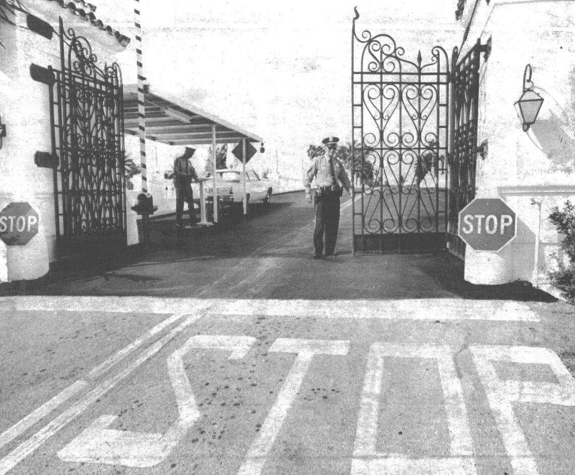 In 1968, Patrolmen John Watson, left, and John Mulrooney guard the gate to Indian Creek Village.