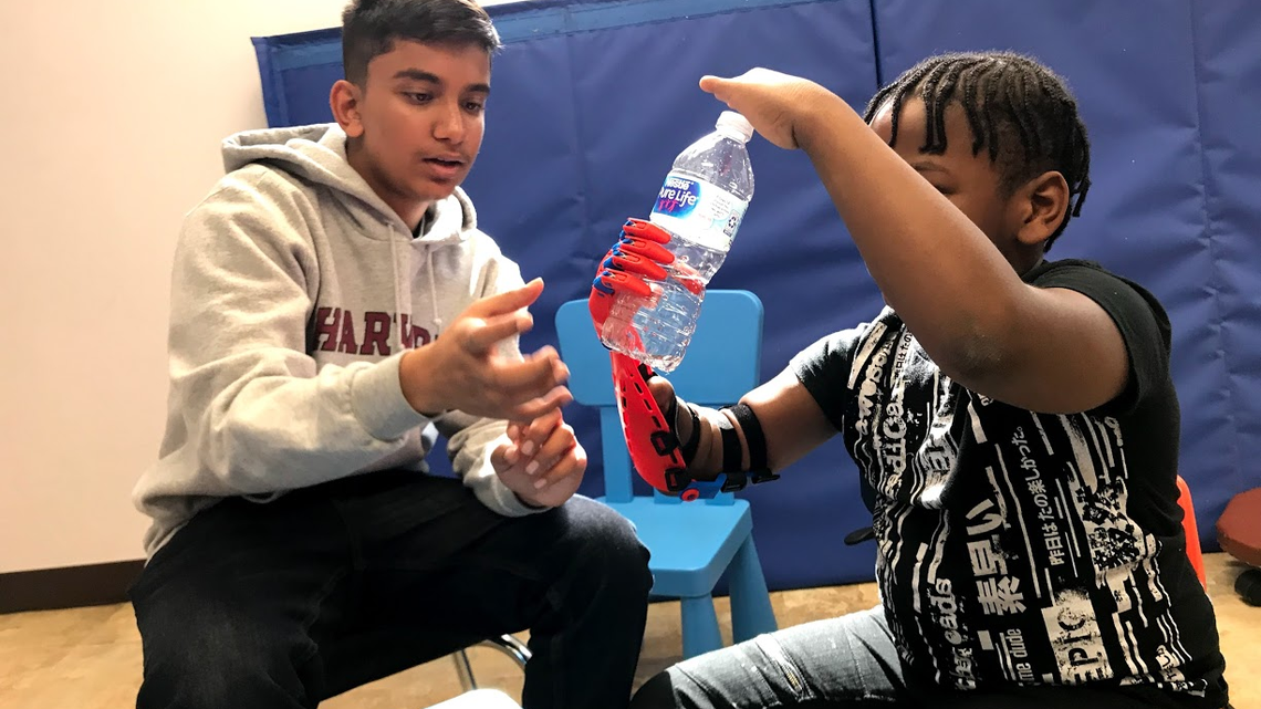 Through the use of 3D printing technology, American Heritage School junior Rishab Jain fitted a 7-year-old Fort Lauderdale boy with a Spider-Man-themed prosthetic hand in January. Rishab will continue to update the hand as the boy grows.