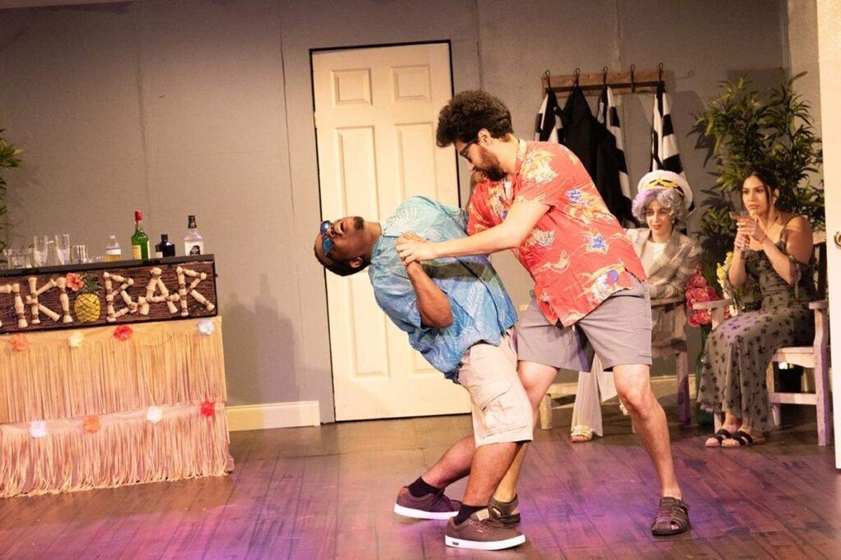 Malik Archibald and Freddy Valle goof around on a cruise ship while Emalie Belokon and Elizabeth Chavez look on.
