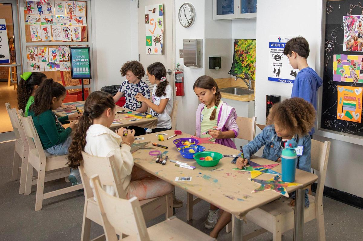 Children decorate wooden stars for the Miami Children’s Museum’s Stars of Hope project in Miami on Tuesday, June 14, 2022. The ongoing project allows children to decorate stars that are sent to Krakow JCC to be given to children from Ukraine, who are now refugees in Poland.