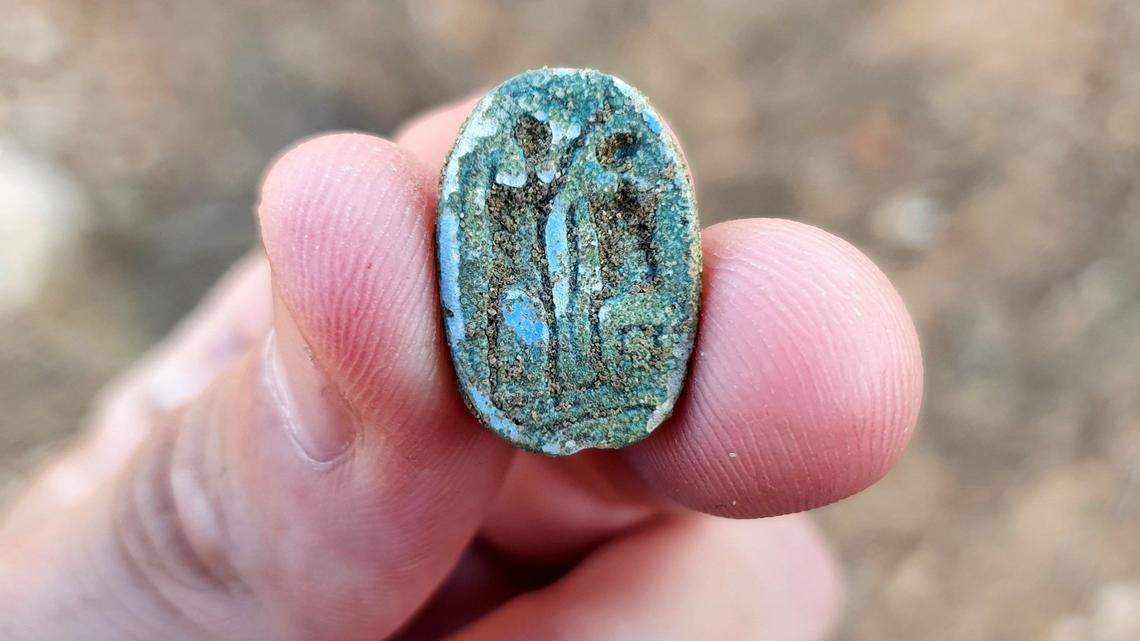 The tour guide of an eighth grade school trip unearthed a scarab seal linked to ancient Egypt in the dirt of an archaeological site in Azor.