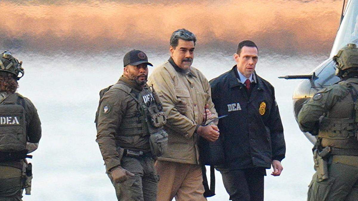Nicolas Maduro in handcuffs after landing at a Manhattan helipad, escorted by heavily armed Federal agents as he and his wife make their way into an armored car en route to a federal courthouse in Manhattan on Jan. 5, 2026, in New York City.