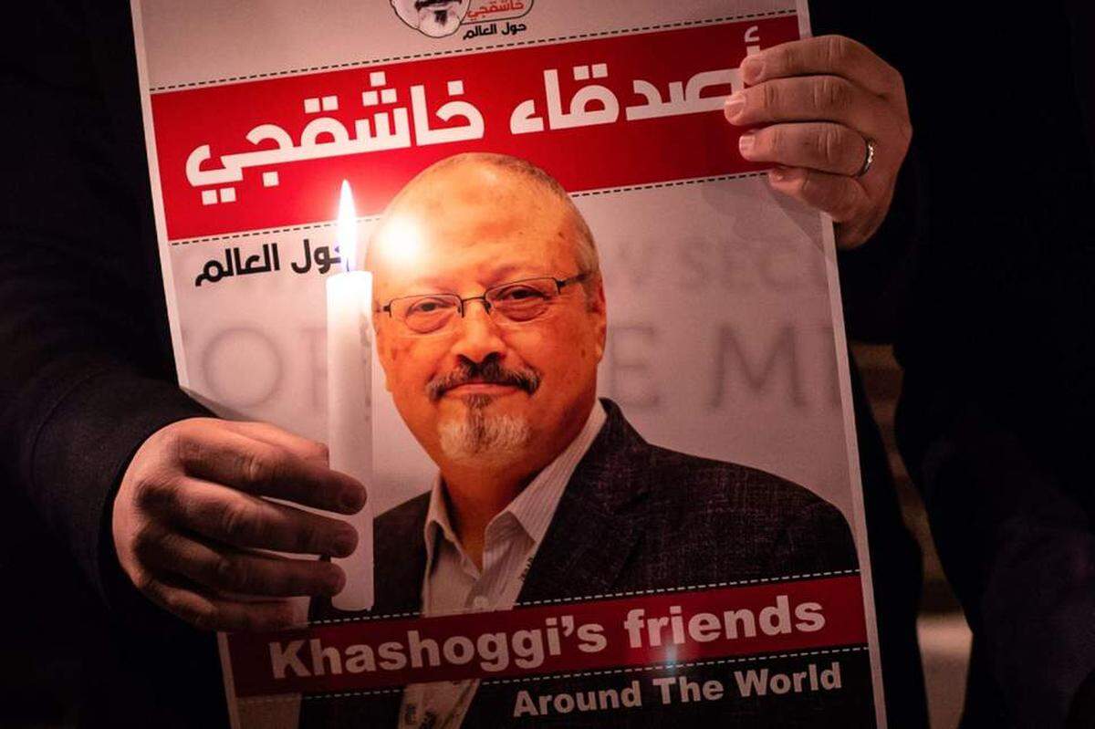 A demonstrator holds a poster of Jamal Khashoggi outside the Saudi Arabia consulate in Istanbul.