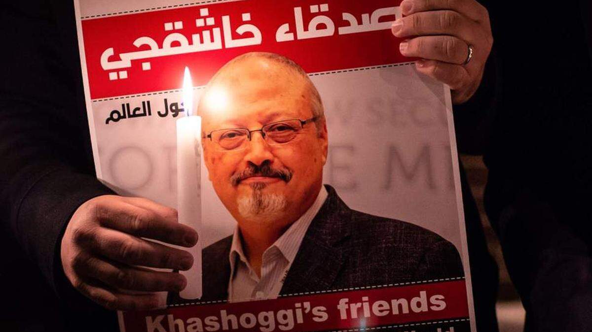 A demonstrator holds a poster of Jamal Khashoggi outside the Saudi Arabia consulate in Istanbul.