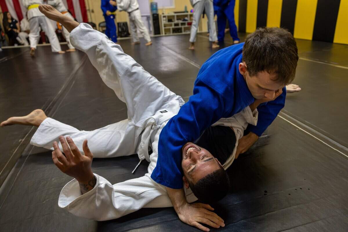 Daniel Lopez, right, completes a throw on Romeo Chacon, left, during randori at Baragua Judo Kai in Miami, Fla., on Wednesday, June 3, 2026.