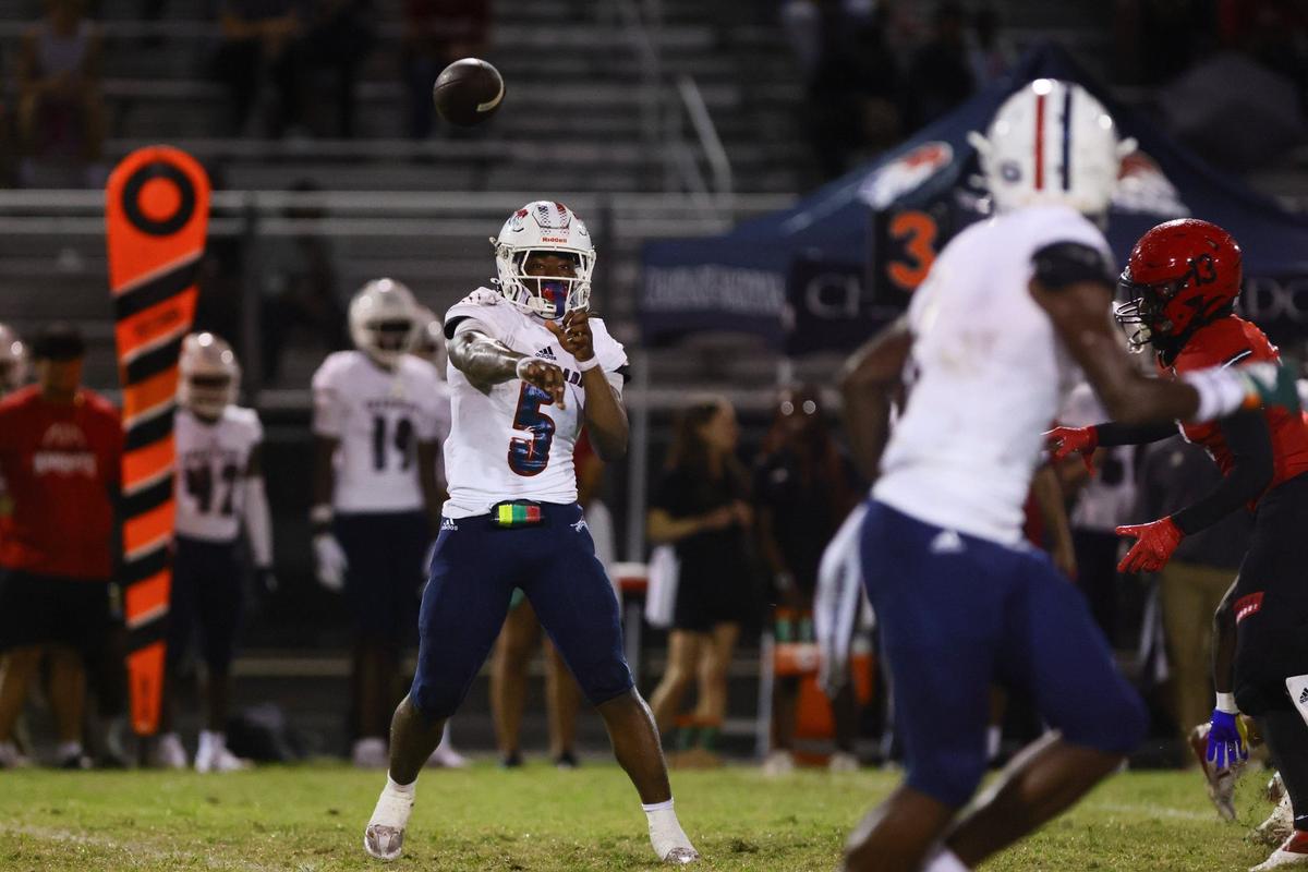 Chaminade-Madonna Lions running back Jaquari Lewis (5) throws the football against the Monarch Knights during the first quarter of a high school football game at Coconut Creek High School in Coconut Creek, Florida, Saturday, October 5, 2024.