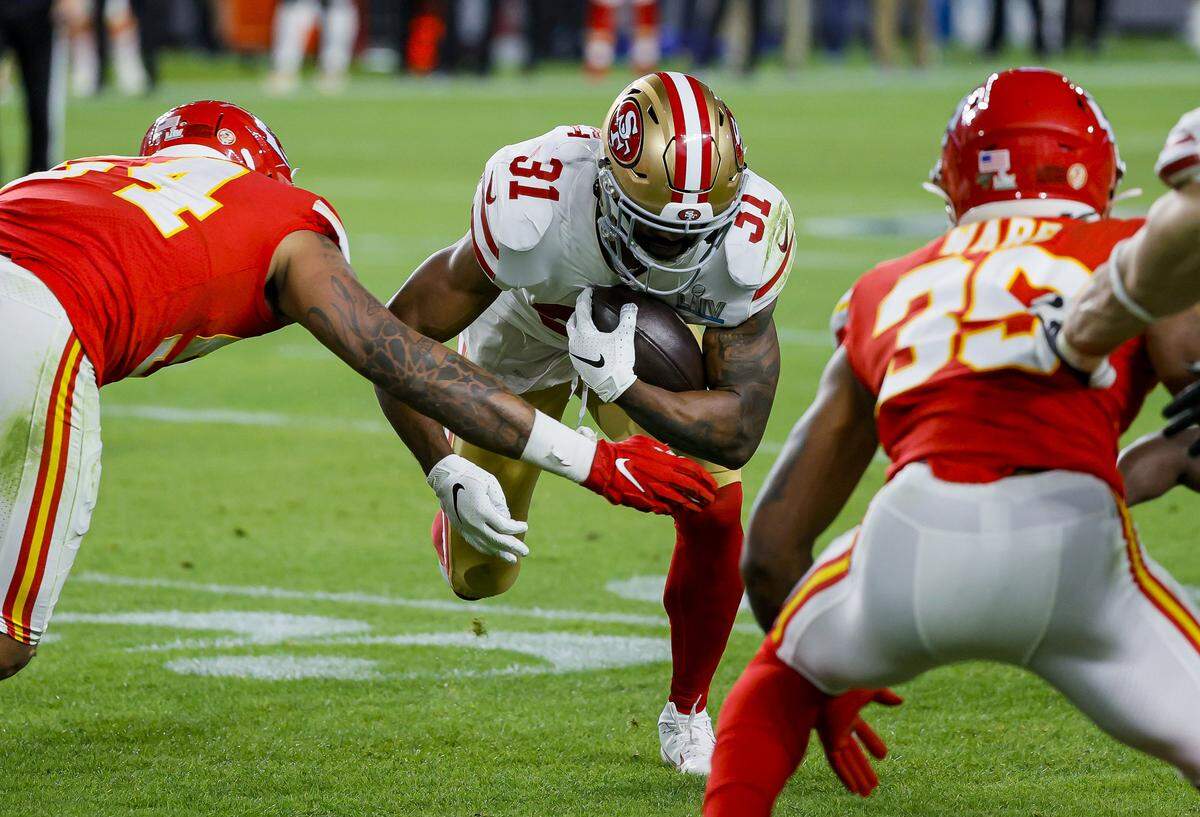 San Francisco 49ers running back Raheem Mostert (31) runs the ball against Kansas City Chiefs during the second half of Super Bowl 54 at Hard Rock Stadium in Miami Gardens, Florida on Sunday, February 2, 2020.