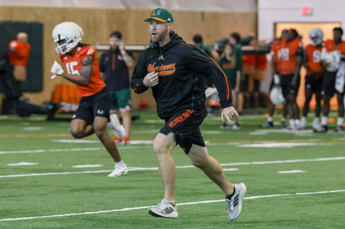 Miami Hurricanes Defensive Coordinator / Linebackers Coach Corey Hetherman runs during practice at the Carol Soffer Indoor Practice Facility on the University of Miami campus in Coral Gables, Florida, on Thursday, March 26, 2026.
