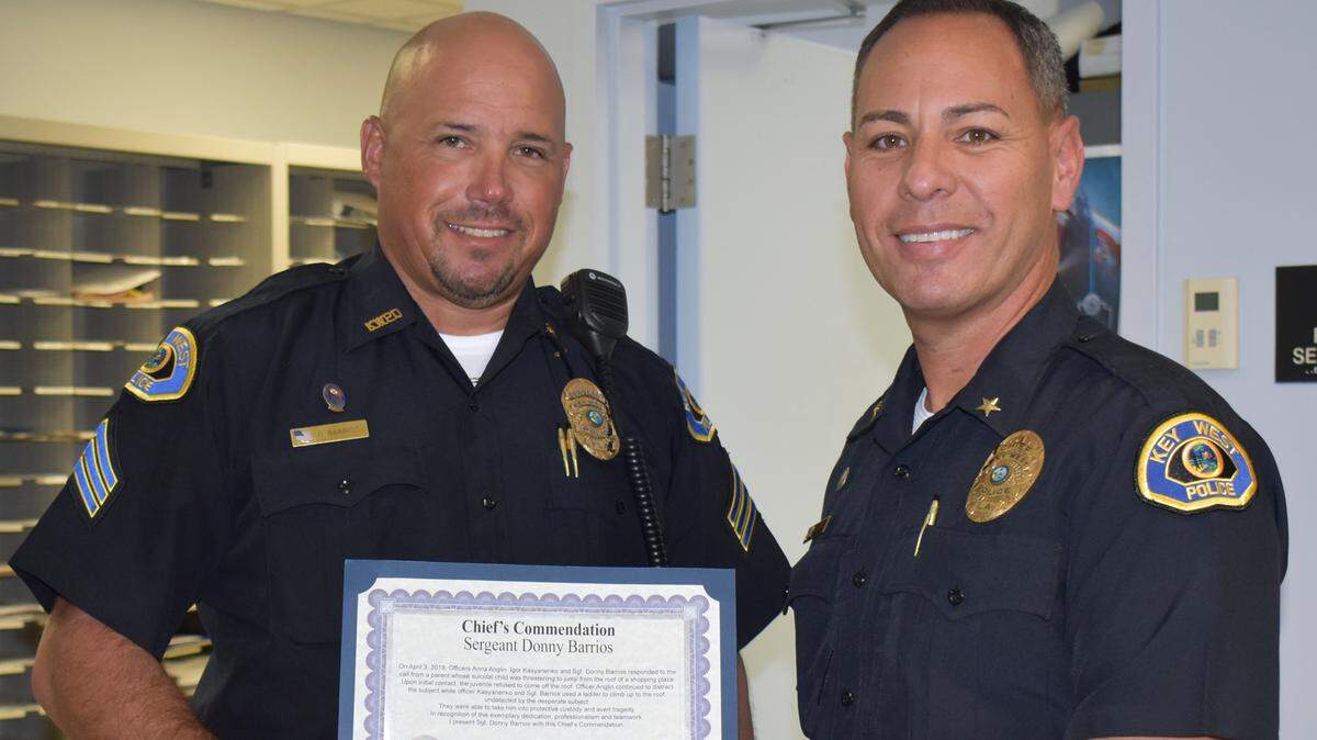 Key West Police Sgt. Donny Barrios accepts a commendation from Chief Donie Lee at a recent awards ceremony.