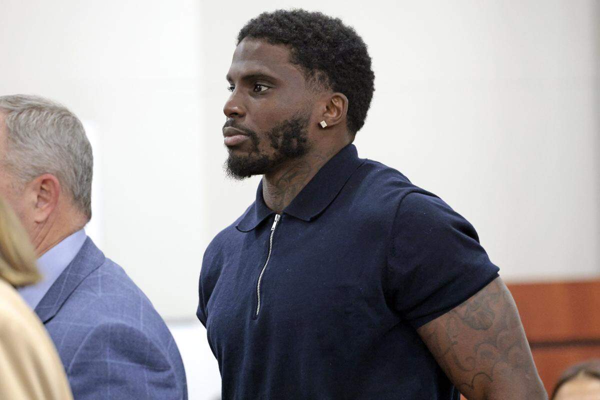 Former Miami Dolphins wide receiver Tyreek Hill enters the courtroom on the first day of his civil trial at the Broward County Courthouse in Fort Lauderdale on Thursday, May. 7, 2026. 