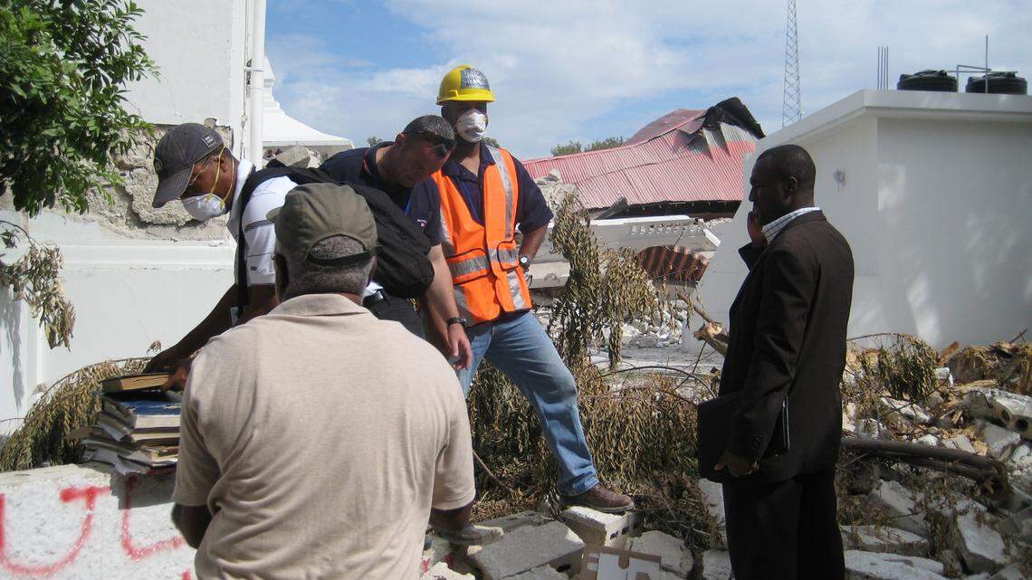 Haiti-born earthquake expert Reginald DesRoches on a visit to Haiti after the country’s devastating 2010 earthquake. Wearing a hard hat, he is seen here discussing options with the ministry of justice. DesRoches has been named the first Black and immigrant to head Rice University in Houston, Texas.