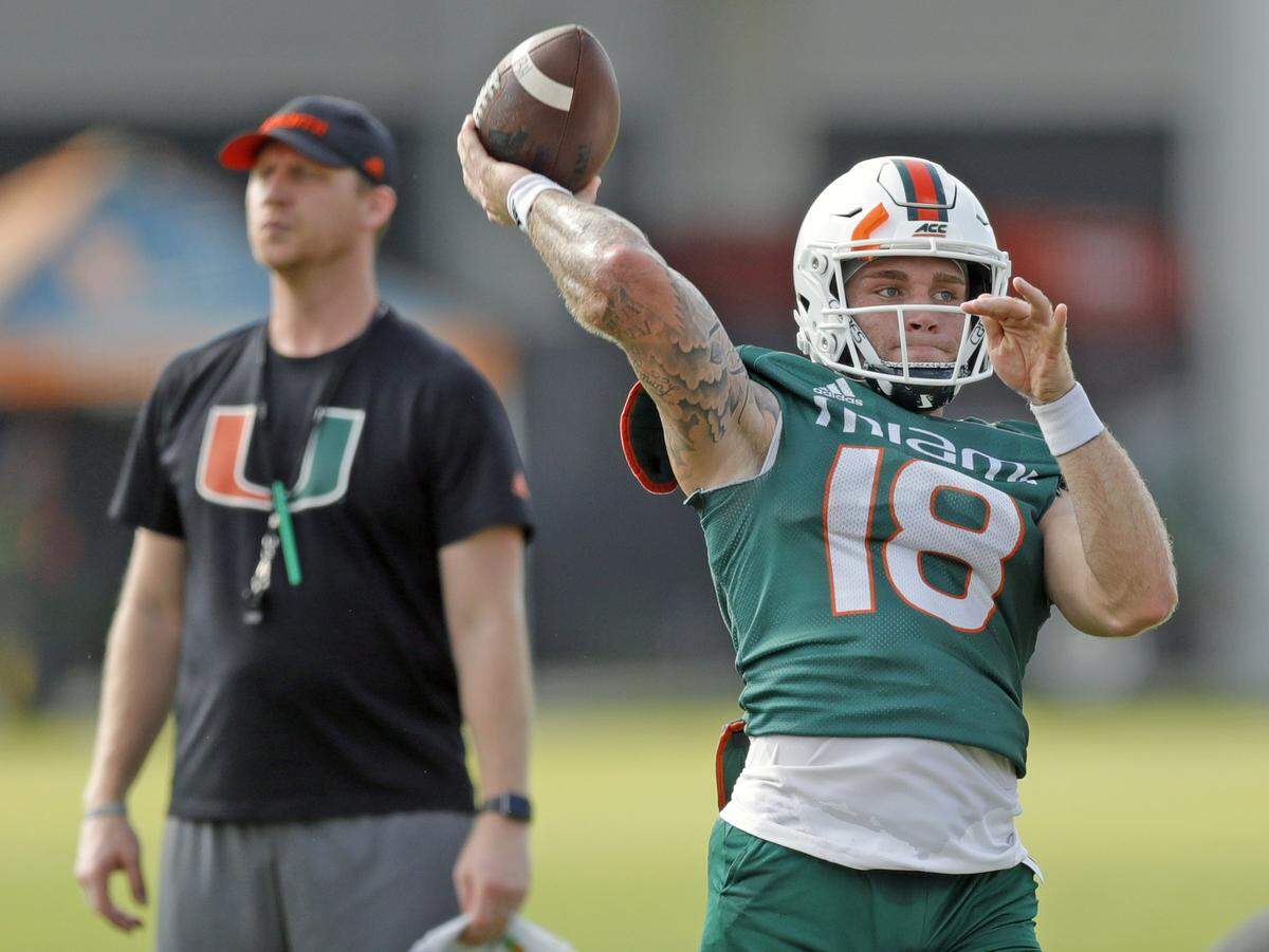 Miami Hurricanes quarterback Tate Martell (18) passes during practice drills at the University of Miami’s Greentree Field in Coral Gables on Thursday, March 5, 2020.