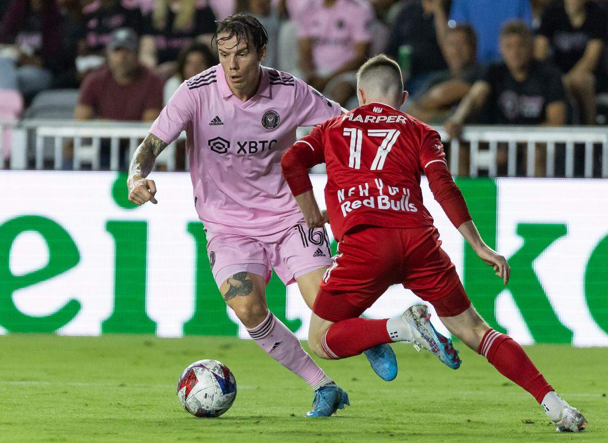 Inter Miami midfielder Robert Taylor (16) runs with the ball as New York Red Bulls forward Cameron Harper (17) defends in the second half of an MLS game at DRV PNK Stadium on Wednesday, May 31, 2023, in Fort Lauderdale, Fla.