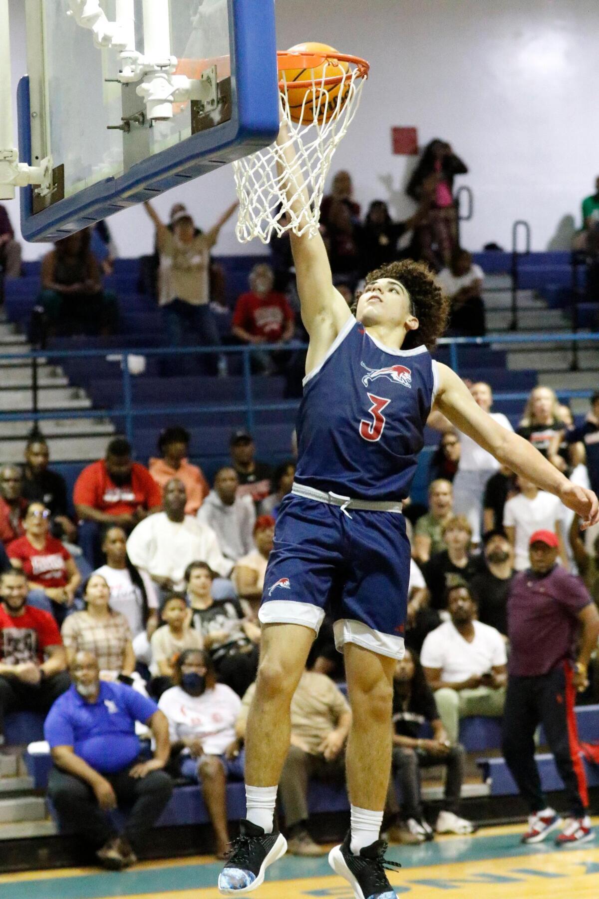 Chaminade-Madonna Lions Jasen Lopez (3) dunks against St. Thomas Aquinas Raiders during 2025 BCAA Big 8 Boy’s Basketball final game Saturday, February 01, 2025 at Fort Lauderdale HS in Fort Lauderdale. Andrew Uloza / for Miami Herald